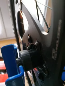 Wheel hub bracket for wheel truing stand