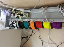 Multiple Filament Spool Holder and Dispenser Under a Table With a Broomstick