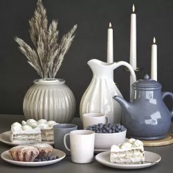 A set of dishes with cake muffins and dried flowers 3D model