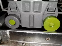 Dishwasher wheel and peg