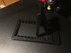 Universal phone/tablet stand with adjustable angle.