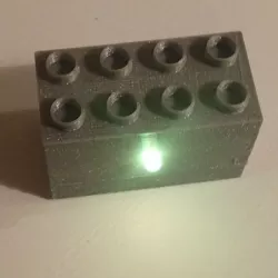 Duplo brick with RGB LED and microcontroller