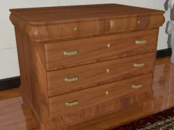 A wooden chest of drawers
