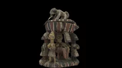 Divination bowl carved with leopard and figures