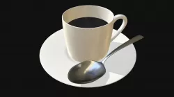 Coffee cup with saucer and spoon