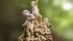 Children blowing a conch shell