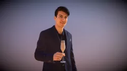 Casual Man Standing Patrick Glass of Champagne