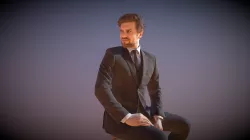 Elegant Sitting Business Man Ian Turning Around