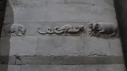 Medieval Dragon (bas-relief) on leaning Tower