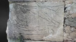 Roc relief with a boat and the inscription