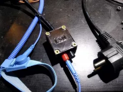 ESD adapter box for grounding via ground wire of AC power plug
