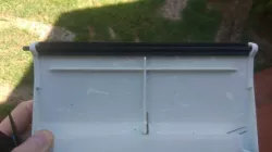 Swimming pool skimmer clamping hinge/shaft