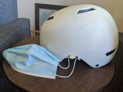 Attachment points for a surgical mask to a helmet