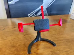 Phone-grabbing phone stand for landscape or portrait