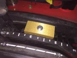 Riding mower deck height stop block