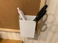 Wall mounted pen holder