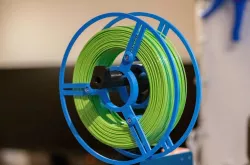 Reusable adjustable spool for spoolless filament
