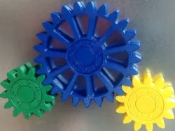 Gears with embedded magnets and integral bearing