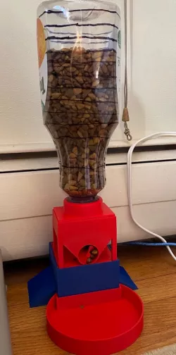 Cat feeder with Tropicana bottle hopper