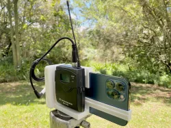 Videographer iPhone 12 Pro Max tripod or hand holder for field production / video