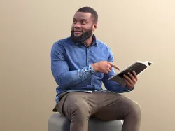 Gabriel 10634 - Black man sitting reading pointing 3D model
