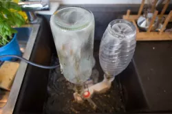 Universal bottle washer for the sink