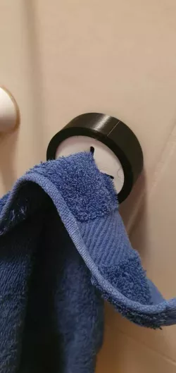 Towel holder pusher thingy