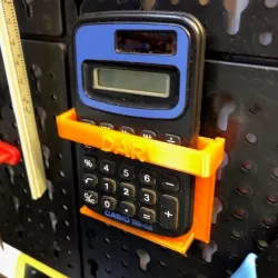 Peg board calculator holder