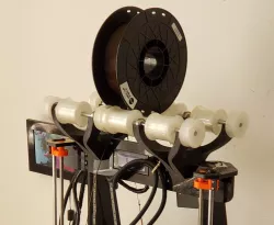Overhead filament rollers