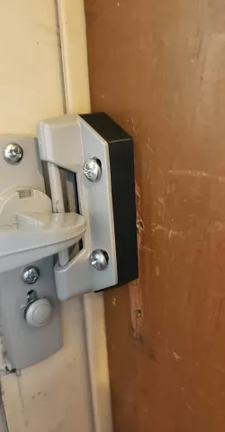 Screen door latch spacer