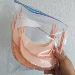 Head shield with and without ventilation holes.
