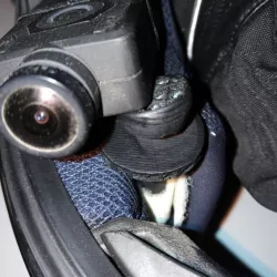 Moto helmet camera support