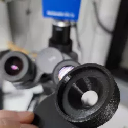 Spacer for microscope eyepiece and mobile phone