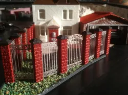 brick and wrought iron fence