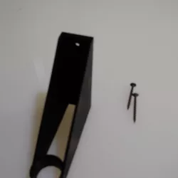 Weed trimmer wall mount