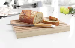 Wooden cutting board with bread 3D model