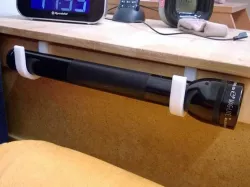 Mag-Lite holder for bed or nightstand