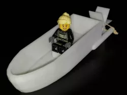 Rubber-band powered paddle boat with Lego seat