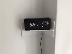 Corner shelf with hole for cable