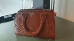 Vuitton bag flower pot modified/remixed with bigger space inside and a drain hole.