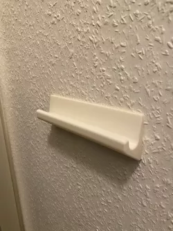 Wall hanger for Leonardo ladder