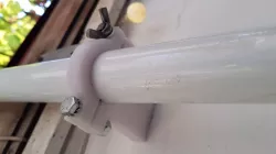 Garden umbrella wall clamp