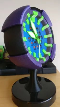 Mini clock for radio-controlled quartz analogue clock movement