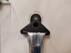 Toothpaste squeezer holder