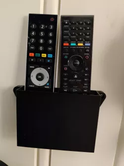 Wall mounted box for remotes