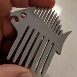 Fish-shaped beard comb