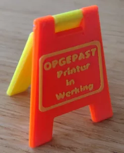 Opgepast printer in werking. Attention printer in operation.