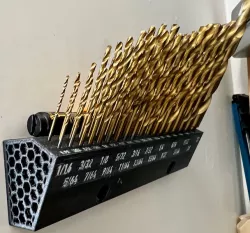 Wall mounted drill bit holder