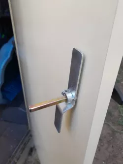 Shed door handle shaft guard