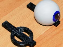 Movable eye adapter for puppet eyelid